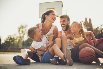 Family after basketball have fun together. - 219951097