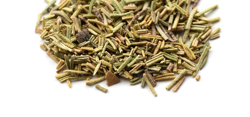 Dry rosemary spice on white. Macro with shallow depth of field.