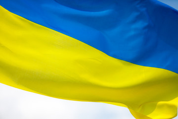 Flag of Ukraine against the blue sky. Horizontal shot.