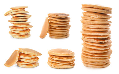 Stacks of tasty pancakes on white background