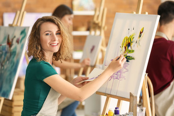 Female student during classes in school of painters