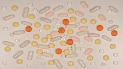 TOP VIEW: Many pills on a white table