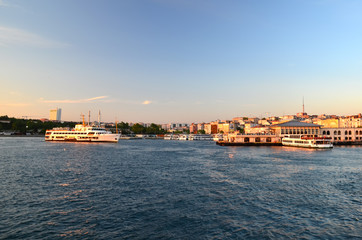 Obraz premium Istanbul, Turkey. Ferries float on waterway.Sea of Marmara. Sunset
