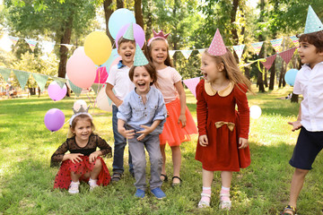 Cute little children at birthday party outdoors