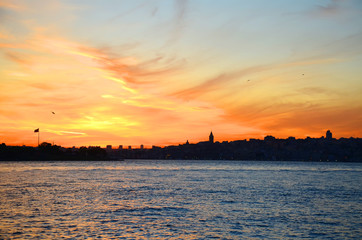 Naklejka premium View of the historical district of Fatih from the sea of Marmara, Istanbul, Turkey. Sunset. Beautiful colorful sky.