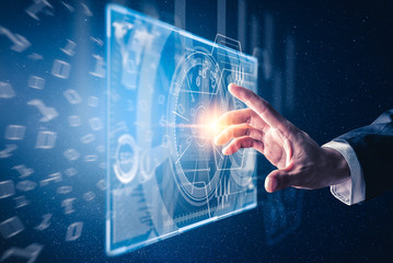 The abstract image of the hand point to the business virtual hologram through the computer screen....
