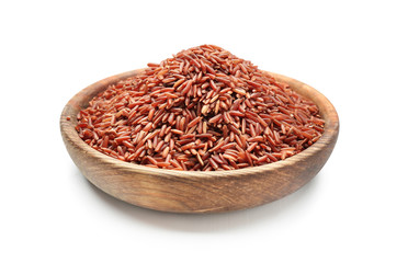 Bowl with red rice on white background