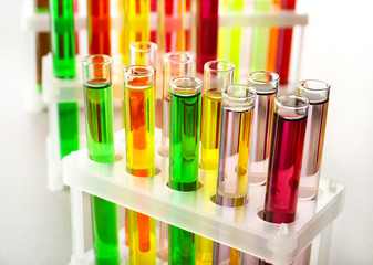 Test tubes with colorful samples in laboratory, closeup