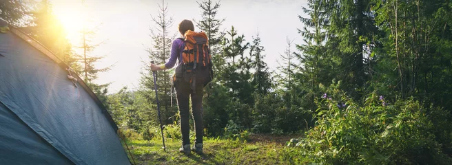 Gordijnen tourist girl on a mountain © Sergii Mostovyi