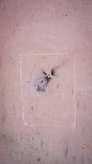 old plastered wall with spots from water