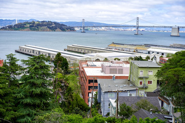 SAN FRANCISCO, CALIFORNIA, USA - MAY 15, 2018: View from the hill to the city port and Bay Bridge