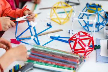 Colored boxes with paper strips, inventions and creativity for children. educational activities for...