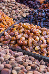Stall with dried fruits including dates. Bazaar of Zanjan city, Iran.