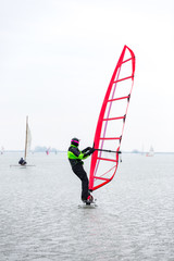 Naklejka premium Ice surfing on the Gouwzee in Monnickendam, the Netherlands.