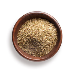 oregano  in a wooden bowl, isolated on white