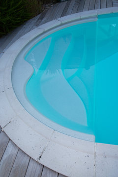 the concrete coping of the blue pool