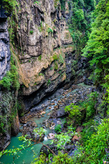 Vertical view of bottom of Enshi Mufu Grand Canyon on rainy day in China