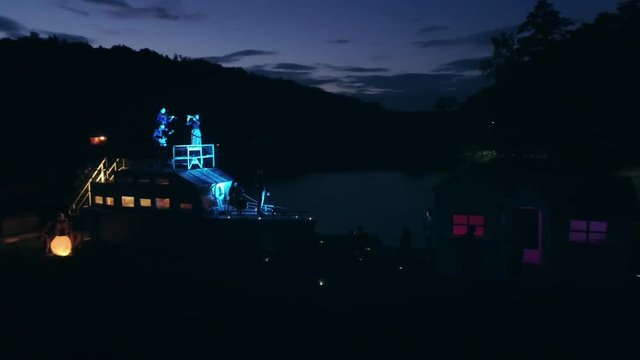 Aerial shot: Night action. A scene of recognition in love, a request of the hand and heart on the ship