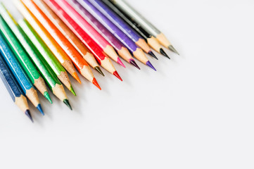 Colour pencil rainbow style,Scale colour of coulour pencil,Colour pencil lay on white paper with sunshine day,Selective focus