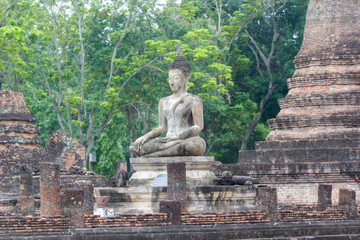 Buddha statues with ruins ancient at Wat Mahathat ancient capital of Sukhothai, Thailand. Sukhothai Historical Park is the UNESCO world heritage