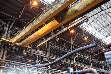 Crane loader carries rebar and wire rod in the factory.