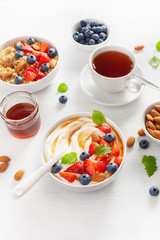 yogurt with strawberry blueberry honey almond and quinoa for breakfast