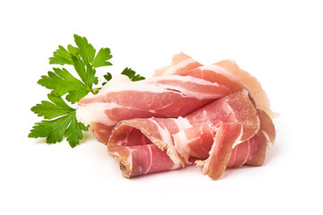 Twisted pieces of pork farmer meat or bacon with parsley, isolated on white background.