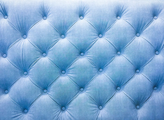 Upholstery sofa fabric with rivets. Blue tone.
