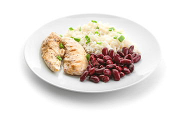 Delicious boiled rice with meat and beans on white background
