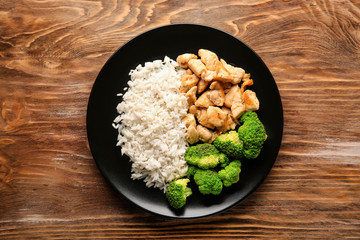 Delicious boiled rice with meat and broccoli on plate