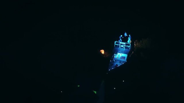Aerial shot: Night action. A scene of recognition in love, a request of the hand and heart on the ship