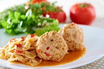 American cuisine. Pasta with meatballs and basil with sauce.