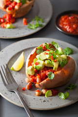 baked sweet potatoes with avocado chili salsa and beans