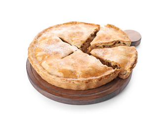 Wooden board with tasty apple pie on white background