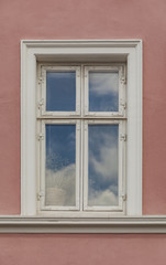 Fototapeta na wymiar Window on the colorful facade