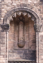 Edinburgh, Scotland, UK - June 14, 2012: Brown stone blindfolded lady justice statue with sword ad...