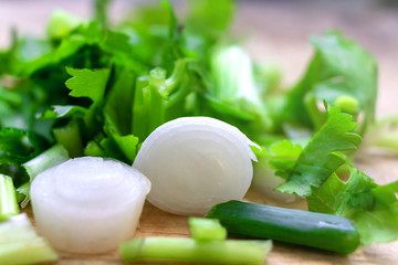 Closeup. Fresh green onions on a cutting board.
