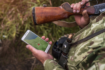 Search for a hunter while hunting geolocation and location. Phone navigation. Hunting, navigation,...