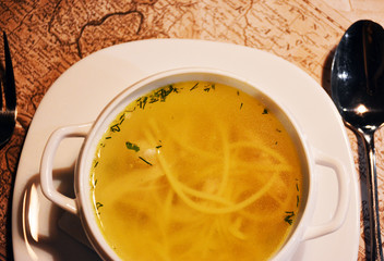 Chicken broth in a white plate