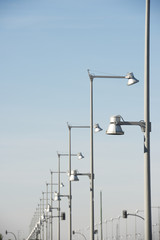 Streetlamps and blue sky