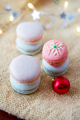 Colorful macaroons and cinnamon sticks .Christmas card.