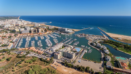 Fototapeta premium Aerial view of the bay of the marina, with luxury yachts in Vilamoura.