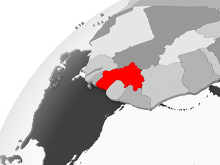 Guinea on grey political globe