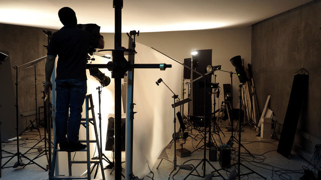 Lighting setup in studio for commercial works such as photo movie or video film production which use many LED light more than 1000 watts with big softbox snoot reflector umbrella and tripods. 