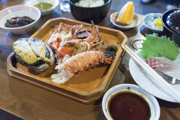 Grilled Japanese spiny lobster and fresh large abalones , popular items in high-class Japanese cuisine , Mie , Japan