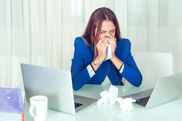 Sick woman working in office