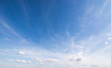 Naklejka na ściany i meble Beautiful blue sky with bright clouds for background photomontage copyspace