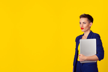 Obraz premium woman with computer laptop isolated on yellow