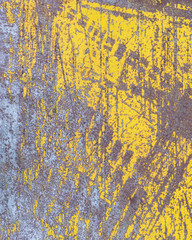 Worn yellow paint on metal sheet texture background