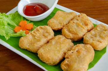 Fried chicken nuggets with tomato sauce. Delicious Dish